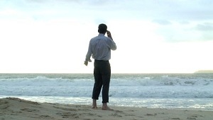 Man on the Beach with Cell/Mobile Phone